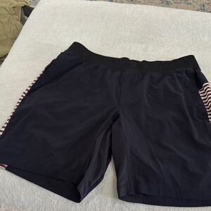 Lululemon Navy Athletic Liner-less Pace Breaker with navy/red strip detail
